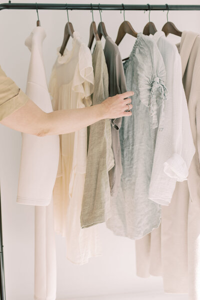 Charly Goss looking through clothing rack in Oakville ON