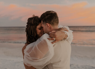 couple hugging at sunset