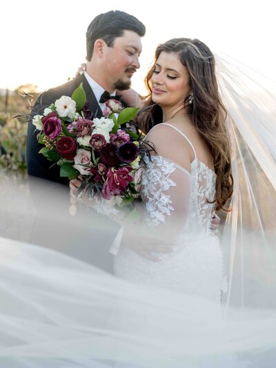 A happy bride and groom during their wedding reception in Paso Robles, California doing their grand entrance to fireworks during their amazing wedding day.