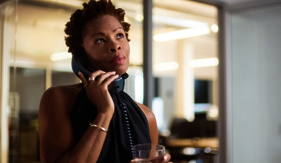 woman in a tv show talking on the phone