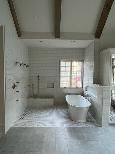 home remodeling in atlanta with Varilko remodeling, showing a bathroom, bathtub, tile, and windows
