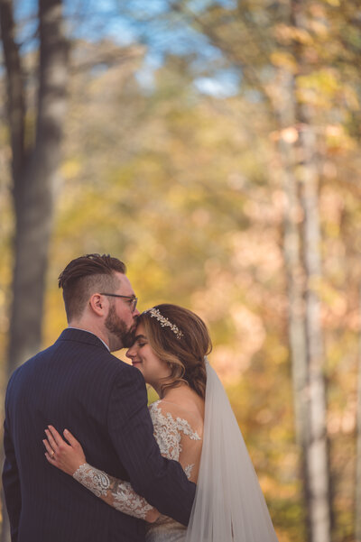 Groom Kissing Bride's forehead, photo by Michigan Wedding Photographer, Shuhrat