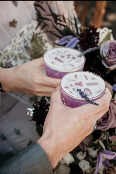 Bride and Groom cheersing a Lavender Lemon Fizz