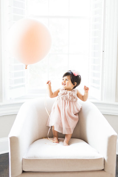 Baby Birthday Photos with Big Pink Balloon Colorado Family Photographer © Bonnie Sen Photography