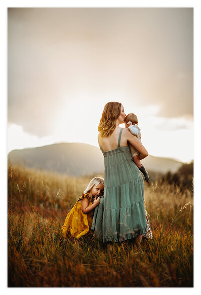 Maternity Photographer, Mother in field with two children