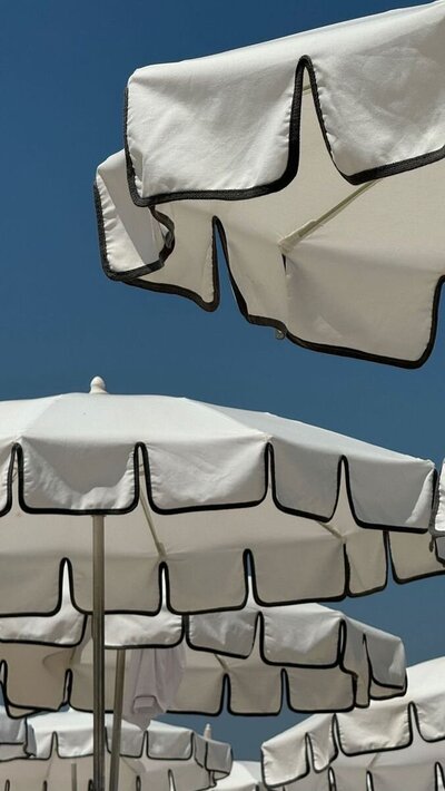 white umbrellas in the sun