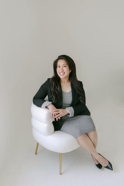 woman sitting in chair during brand photoshoot in dallas texas