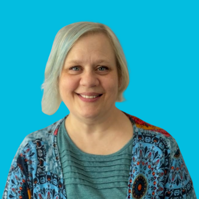 woman therapist at Move Forward with blonde hair and blue shirt on blue background
