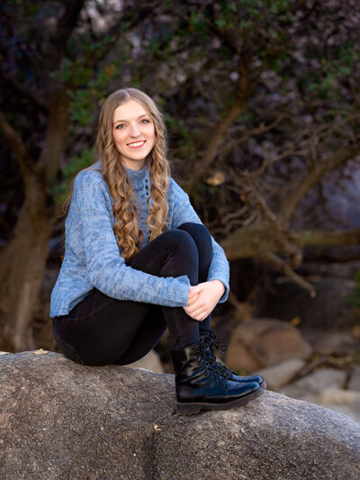 Girl poses on boulder at Willow Lake in Prescott senior photos with Melissa Byrne