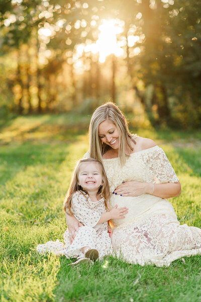 pregnant mother and daughter sitting together by york pa photographer