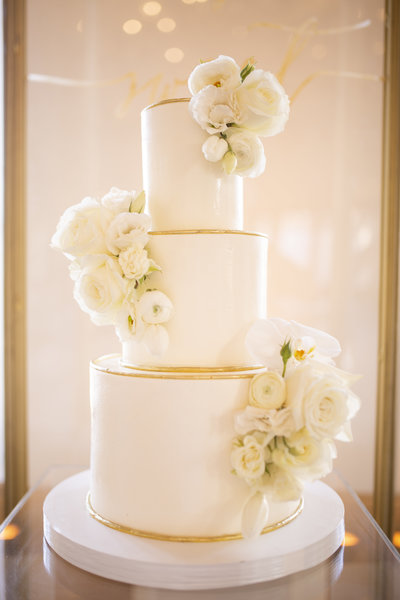 Wedding Photography, close up of white floral wedding cake