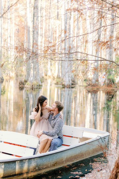 Engaged couple in a boat at Cypress Gardens near Charleston South Carolina