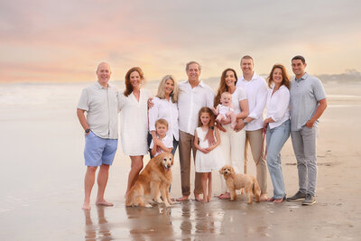 Family walks along the beach together during Family Photoshoot on Folly Beach.