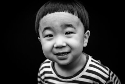 Black and white portrait of Asian boy with classic bowl haircut | Meg Sivakumar Photography in Woodinville, WA