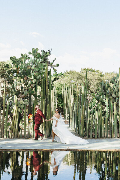 Diana of Joy and Light Photography guiding a couple during portraits, featured in client experience reviews.