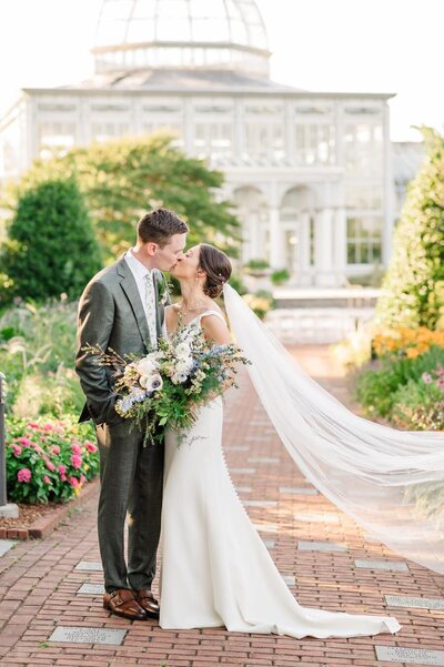 Bride and Groom popping champagne  at Lewis Ginter  Richmond Wedding