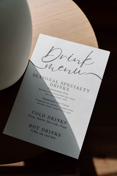 Specialty drink menu at Lavender & Ink Studios featuring cold and hot beverages