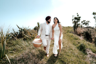 Couple Amrit and Simran walking hand in hand during romantic outdoor proposal session, photographed by Zanthe Vorsatz.