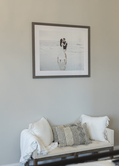 gallery of portraits installed in to a home from a sea island session