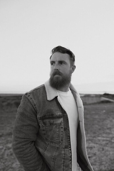 honeybook photographer who uses the honeybook integrations looking into the distance