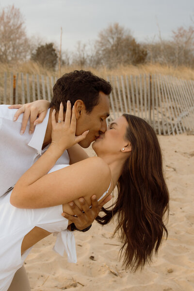 A couple on the beach kissing in Maryland