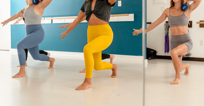 Group of women lunging with weight on their shoulders at Barre Soul Kauai