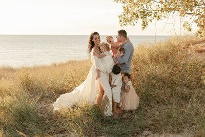 Family playing in golden light captured by a Traverse City photographer

