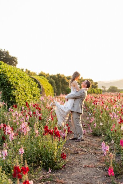bride and groom in flower field