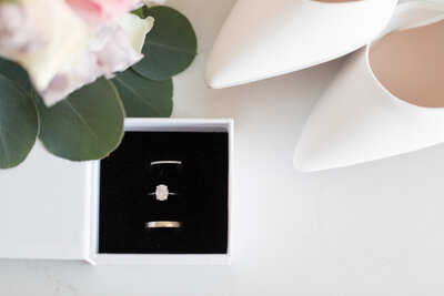 Dive into the exquisite details of your Ottawa wedding captured by Lauren Duffy Photography. This compelling image showcases the perfect trifecta - the gleaming wedding rings, the pure elegance of bridal shoes, and the timeless beauty of a carefully crafted bouquet. As your dedicated Ottawa Wedding Photographer, Lauren Duffy skillfully frames these cherished elements, preserving the essence of your love story. Elevate your wedding memories with the artistry and precision that define Lauren Duffy Photography, your premier choice for capturing the heart and soul of Ottawa weddings