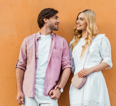 Smiling couple standing close together and holding hands, symbolizing hope and new beginnings through couples therapy and affair recovery with Relationship Experts in Florida, USA, UK, and Canada.