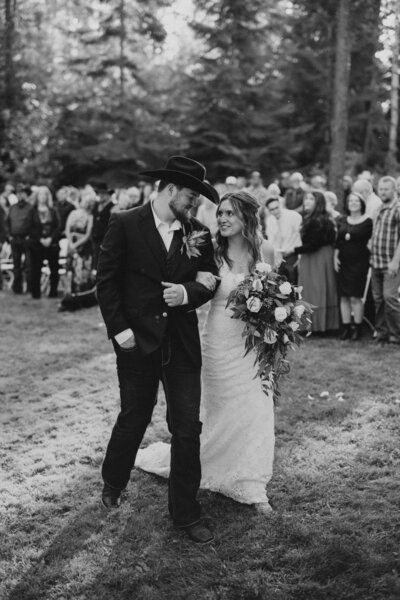 black and white photo of couple and wedding party