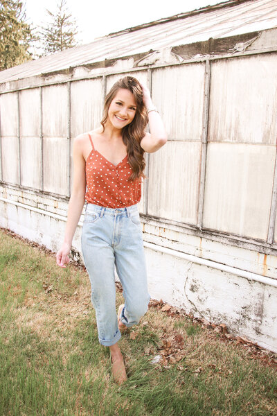 woman smiling standing outside