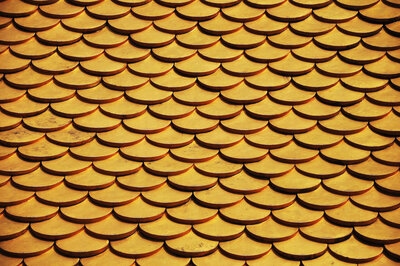 Gold disks stacked on each other to created a shingled look