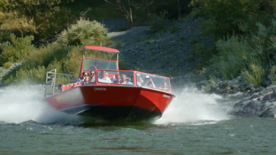 red jet boat on water
