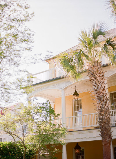 Palm tree and front view of The William Aiken House, Wedding Venue in Charleston, SC