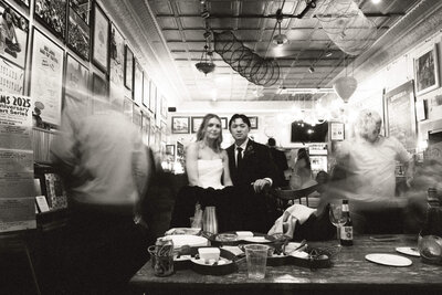 couple standing at the bar at their wedding