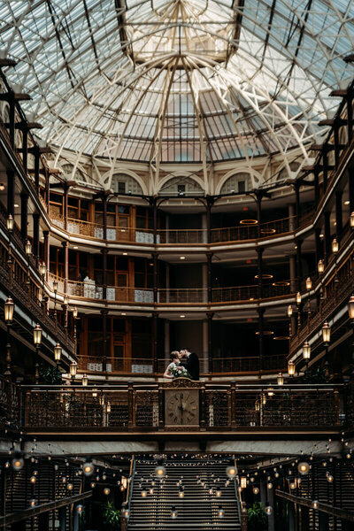 Moody photo of couple kissing in Arcade