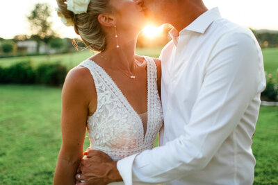 couple-kissing-at-sunset-at-luxury-wedding-in-hampshire