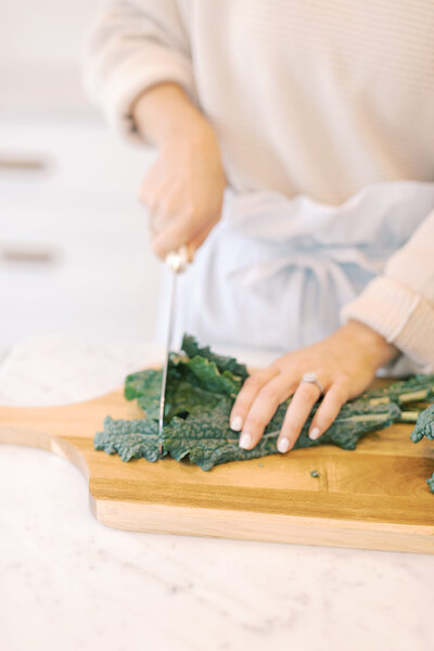 Chopping kale on a cutting board