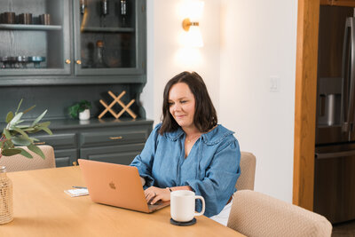 a woman working on her laptop