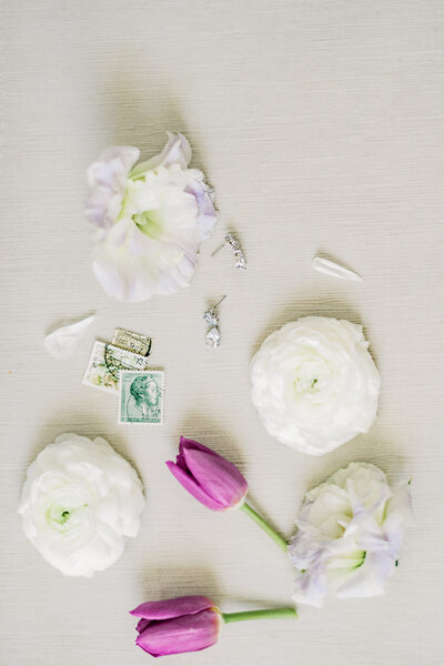 Bridal details, flowers, and earrings, for a Williamsburg wedding coordinated by Sweet Caroline Events. Taken by Morgan Renee Photography.