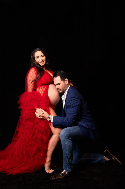 Maternity studio portrait photo of elegant couple