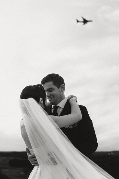 Wedding Couple as Airpline flies by captured by Boston Photographer ZFP