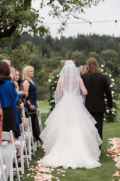 Real bride wearing her heirloom veil and walking down the aisle