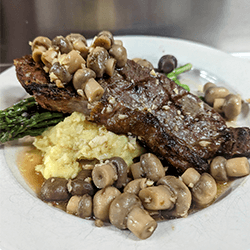 Local Steak with mushrooms at Max Dales Steak and Chop House in Mount Vernon