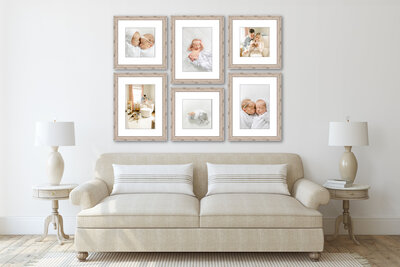 A gallery wall of framed pictures from a twin newborn session sits above a beige couch, Indianapolis portrait photographer