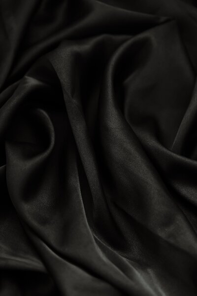 Rolled black silk