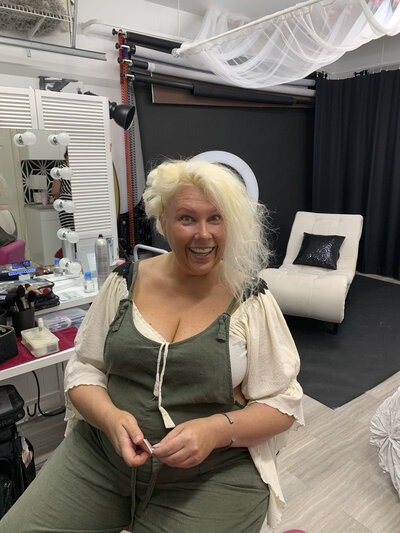 Blonde mature woman before her boudoir shoot and hair and makeup