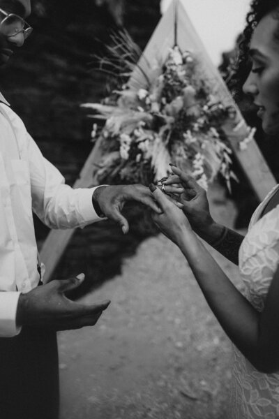 A putting on K's wedding ring