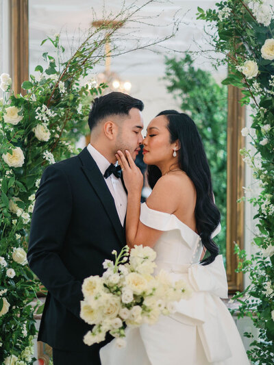 Bride and groom walk back down the aisle smiling after their wedding ceremony
